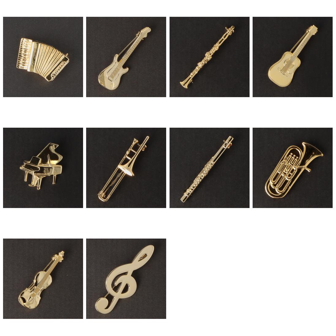 Instrument brooch, various designs, gold-plated