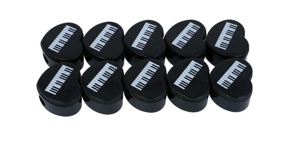 Heart-shaped pencil sharpener with musical note print, treble clef, note mix, keyboard
