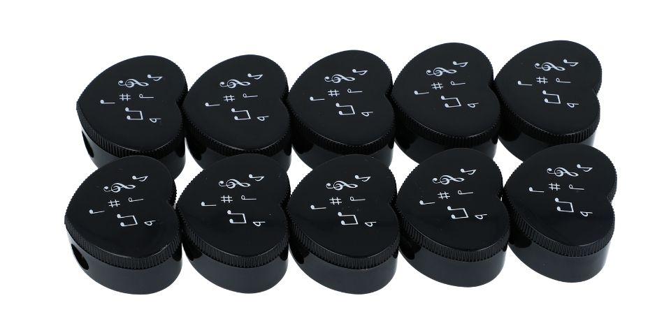 Heart-shaped pencil sharpener with musical note print, treble clef, note mix, keyboard