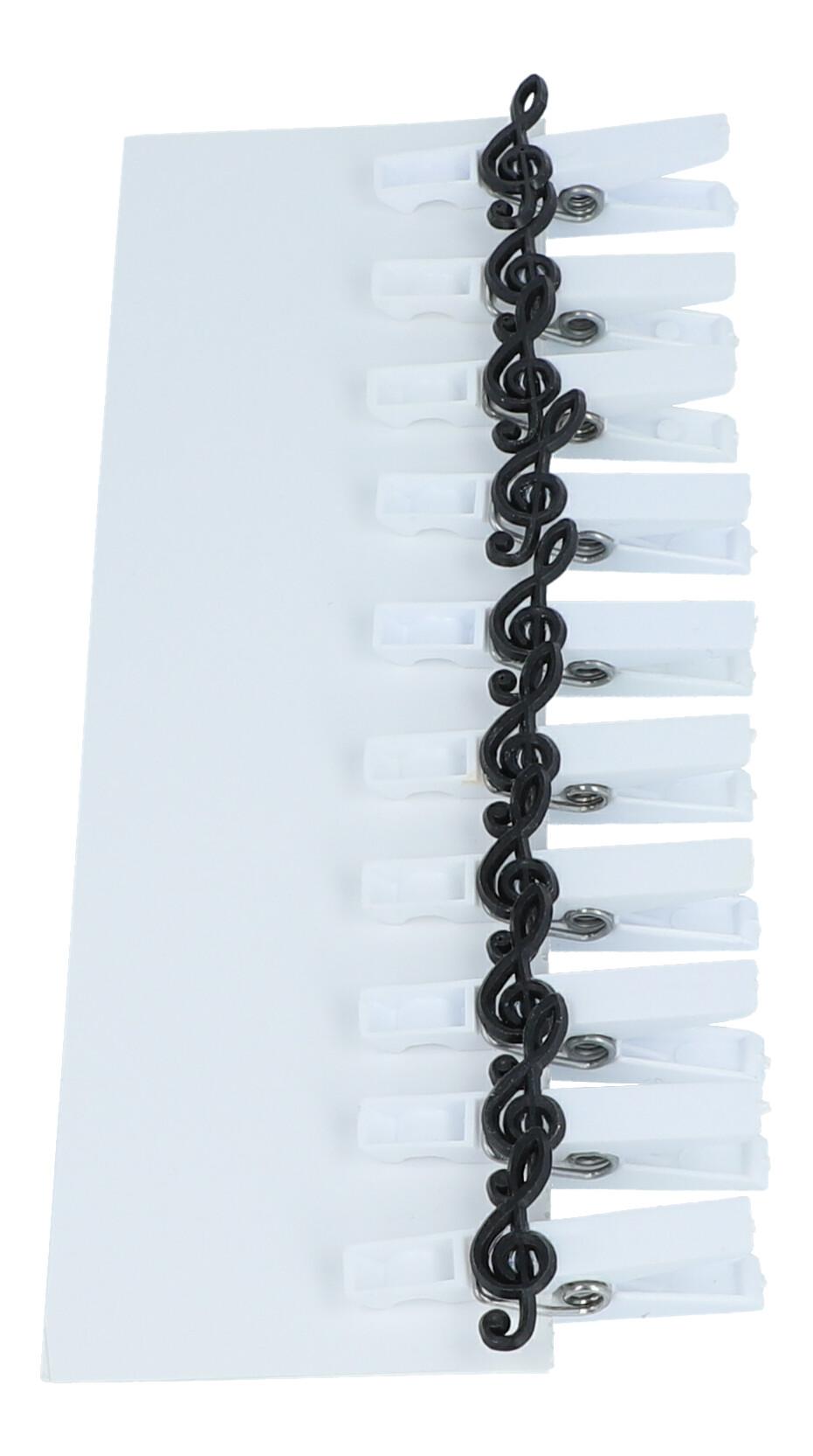 white brackets with attached treble clef