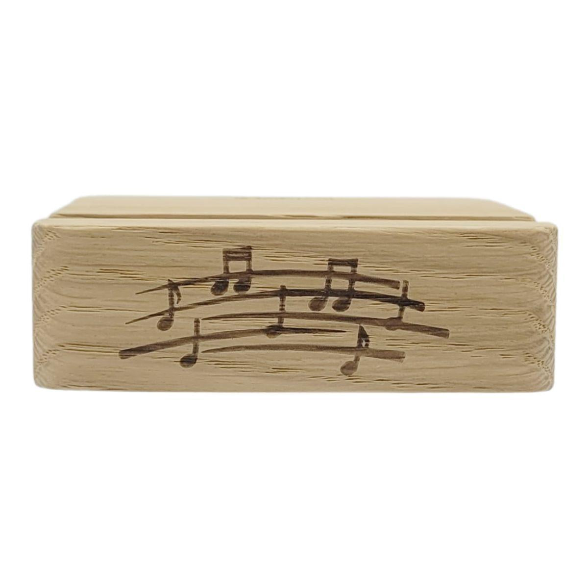 Wooden cell phone holder with music lines