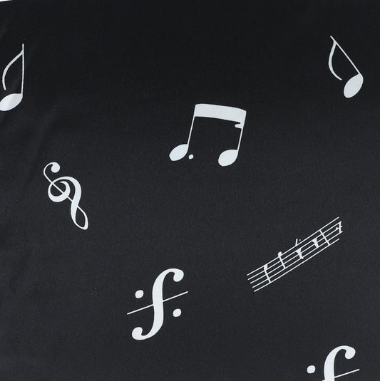 Black fabric by the meter with notes, clefs and staves, polyester satin