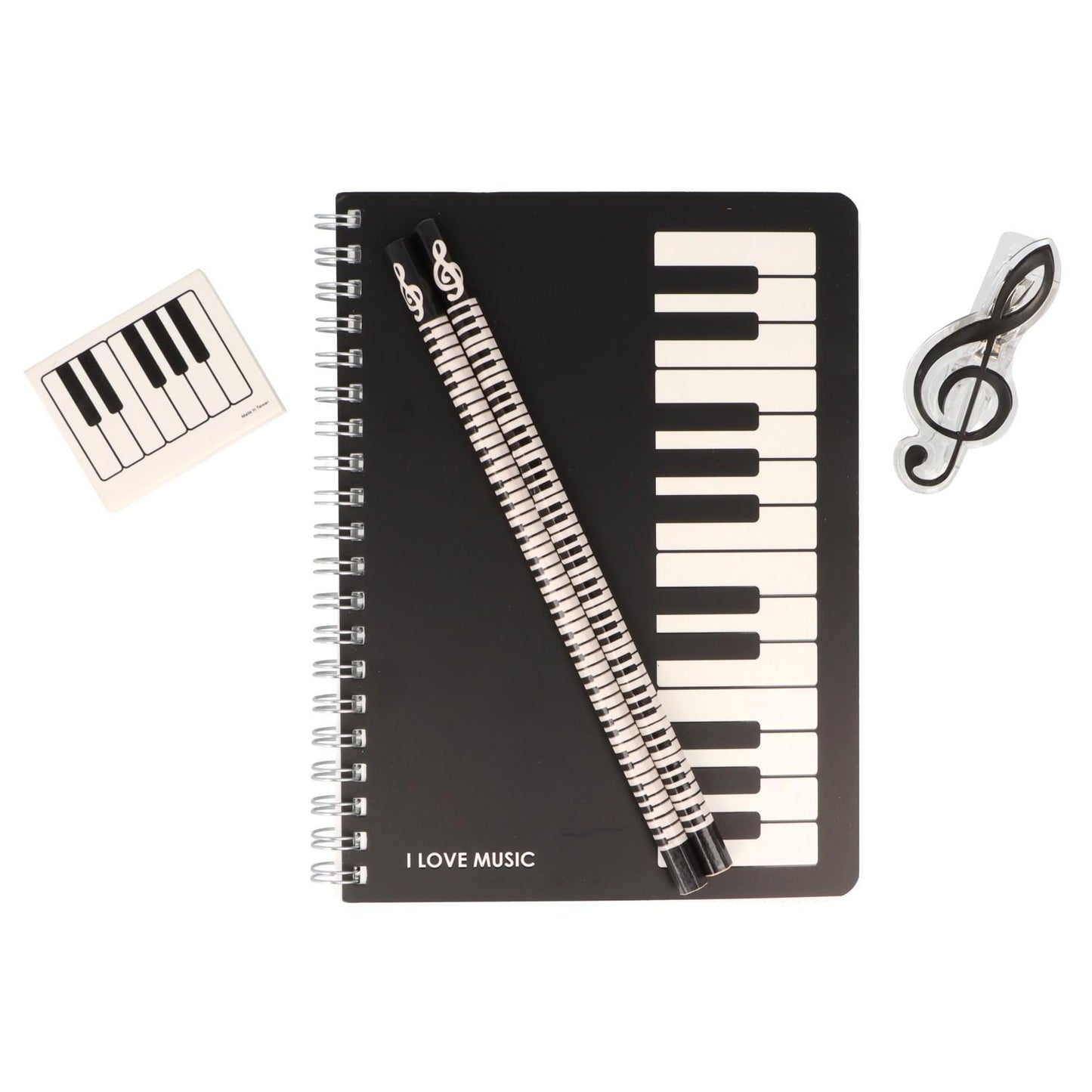 Writing set consisting of a spiral notebook, 2 hexagonal keyboard pencils, treble clef clip and keyboard eraser