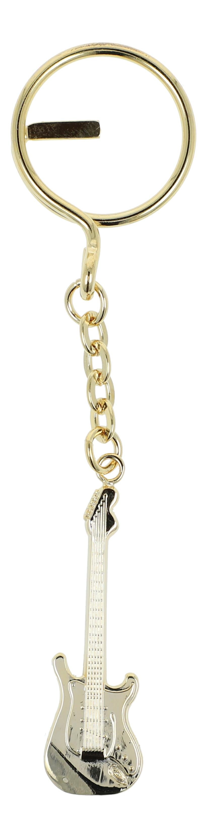 golden metal keychains shaped as instruments or treble clefs