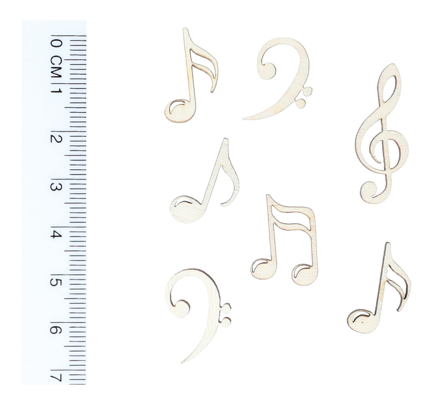 Wooden scatter decoration as notes, treble and bass clef, table decoration