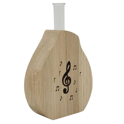 Noble wooden vase including glass cylinder with treble clef and notes