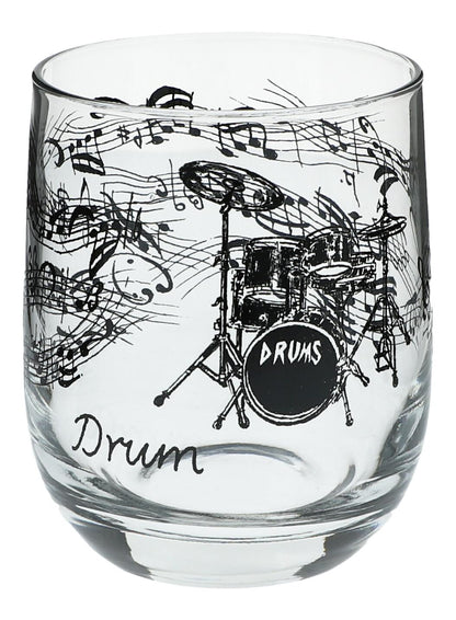 Glas mit Instrumenten und musikalischen Motiven