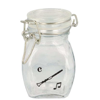 Mini storage jar with various instruments in black