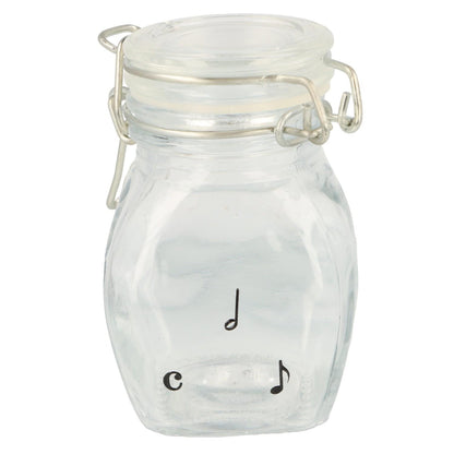 Mini storage jar with various instruments in black