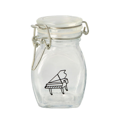 Mini storage jar with various instruments in black