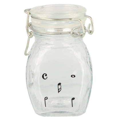 Mini storage jar with various instruments in black