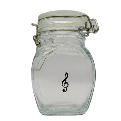 Mini storage jar with various instruments in black