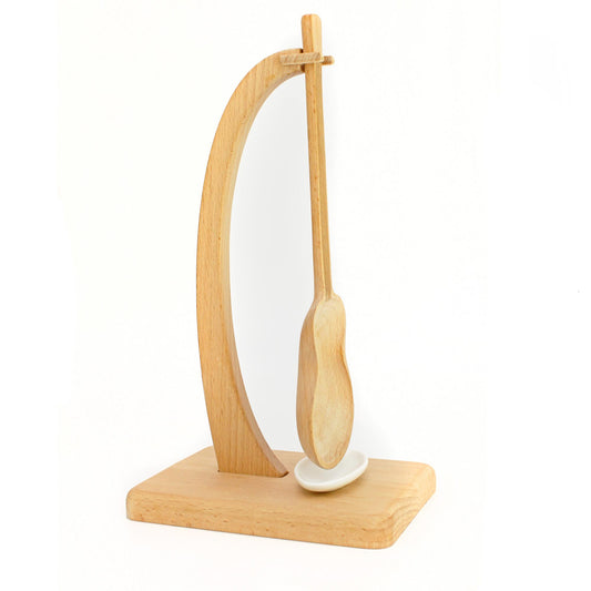 Guitar-shaped cooking spoon with stand and drip tray