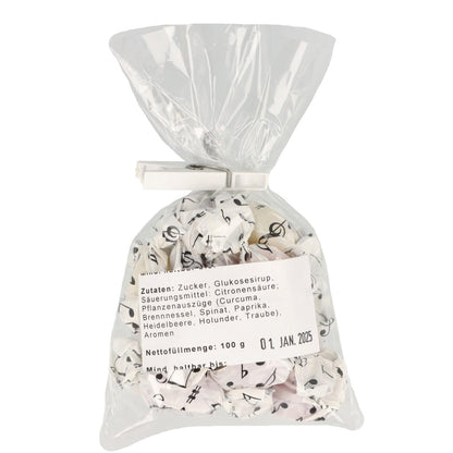 Bonbon-Fruchtmischung mit Noten-Wickelpapier, 100g-Packung mit Violinschlüssel-Klammer