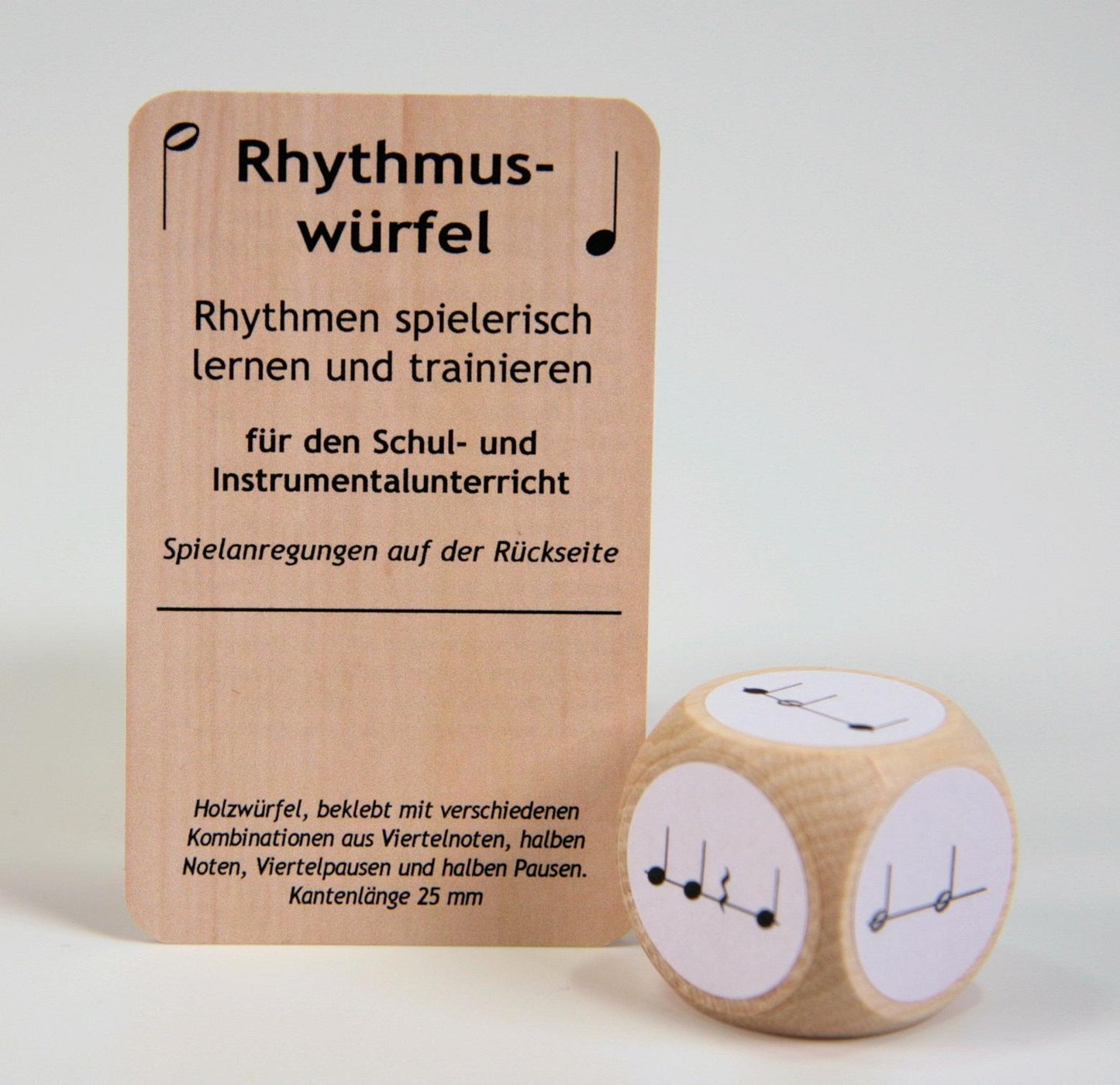 Rhythm cube with combinations of quarter and half notes and rests