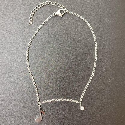 Music anklet with eighth note and crystal