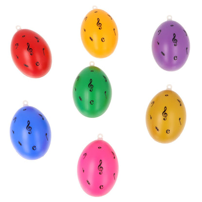 Set of 7 decorative Easter eggs with treble clef and notes, various colors