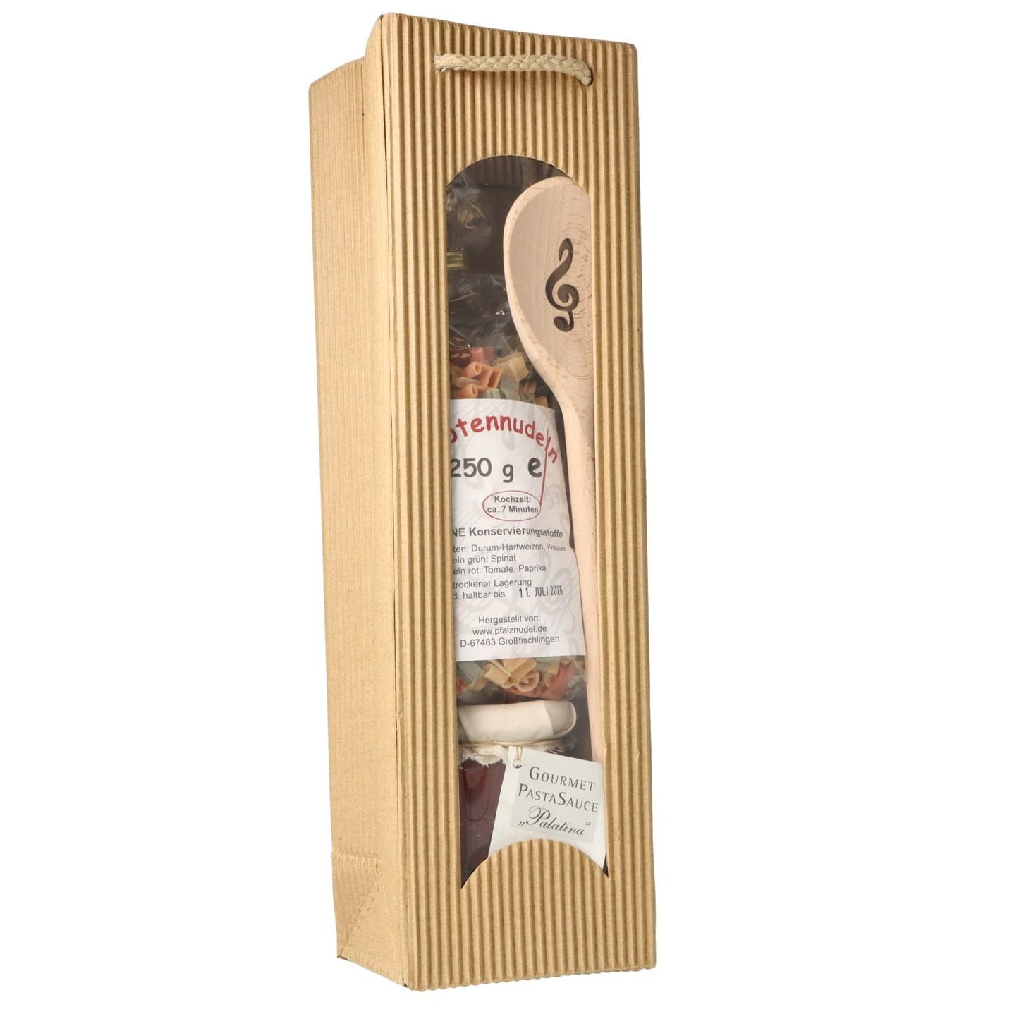 Gift set with music note pasta, treble clef wooden spoon and pasta sauce in carrying bag